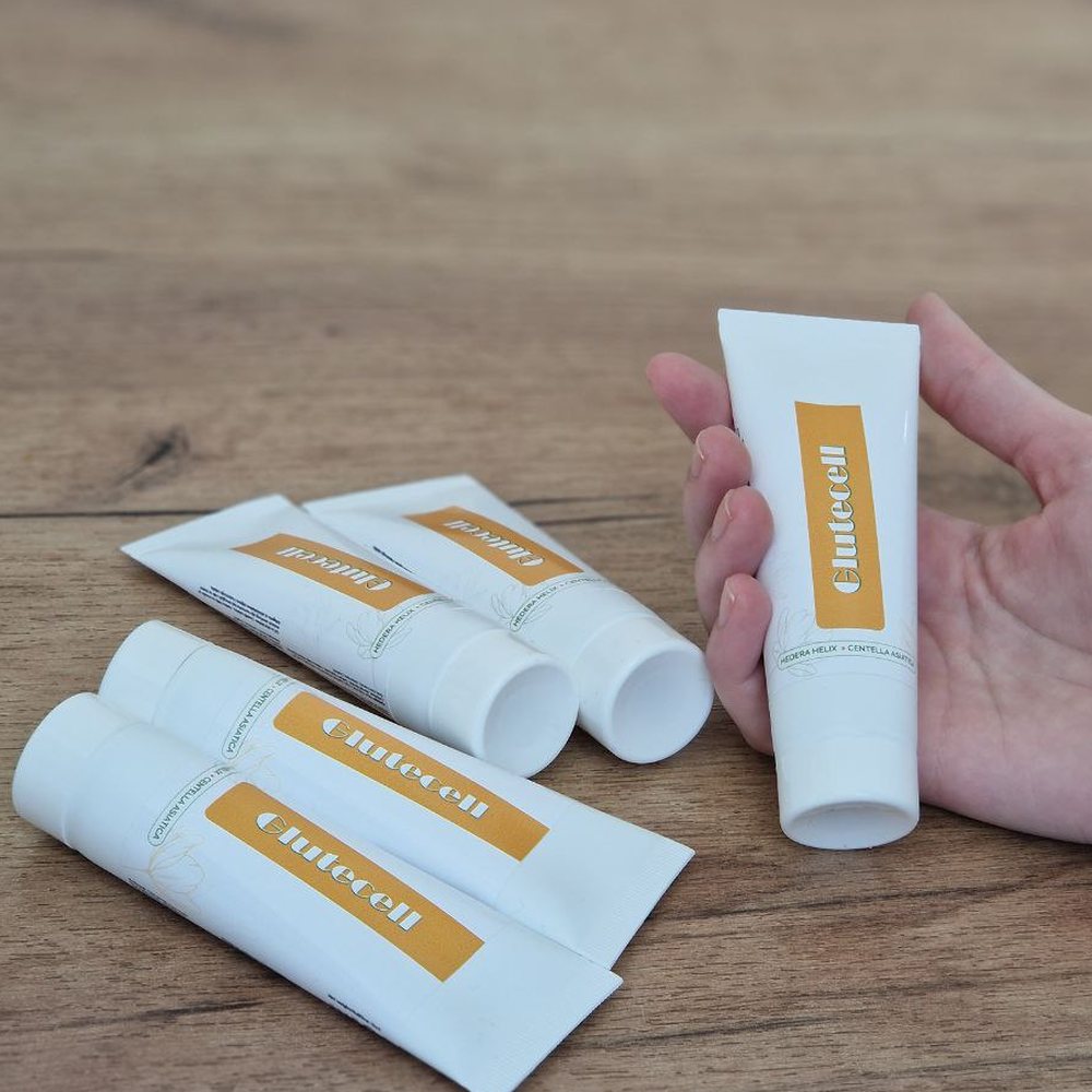 Glutecell, bijele tube kreme s narančastom trakom